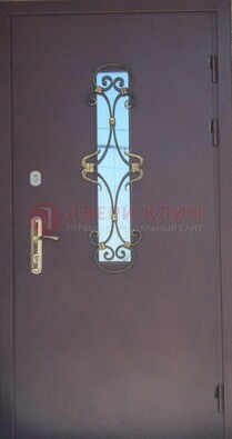 Металлическая дверь со стеклом и ковкой ДСК-77 в Саратове